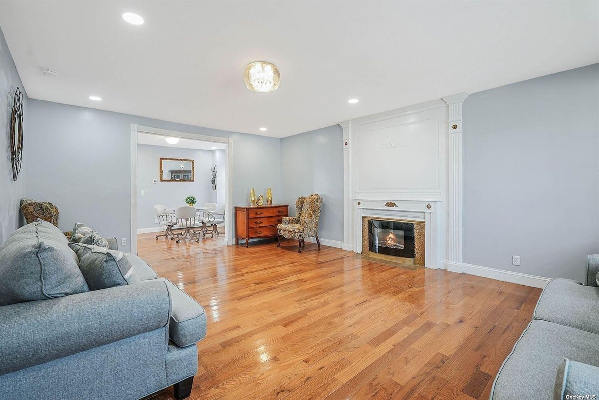 Dining room, Fireplace, Interior, Living room, Recessed Lighting, Wood Texture Flooring
