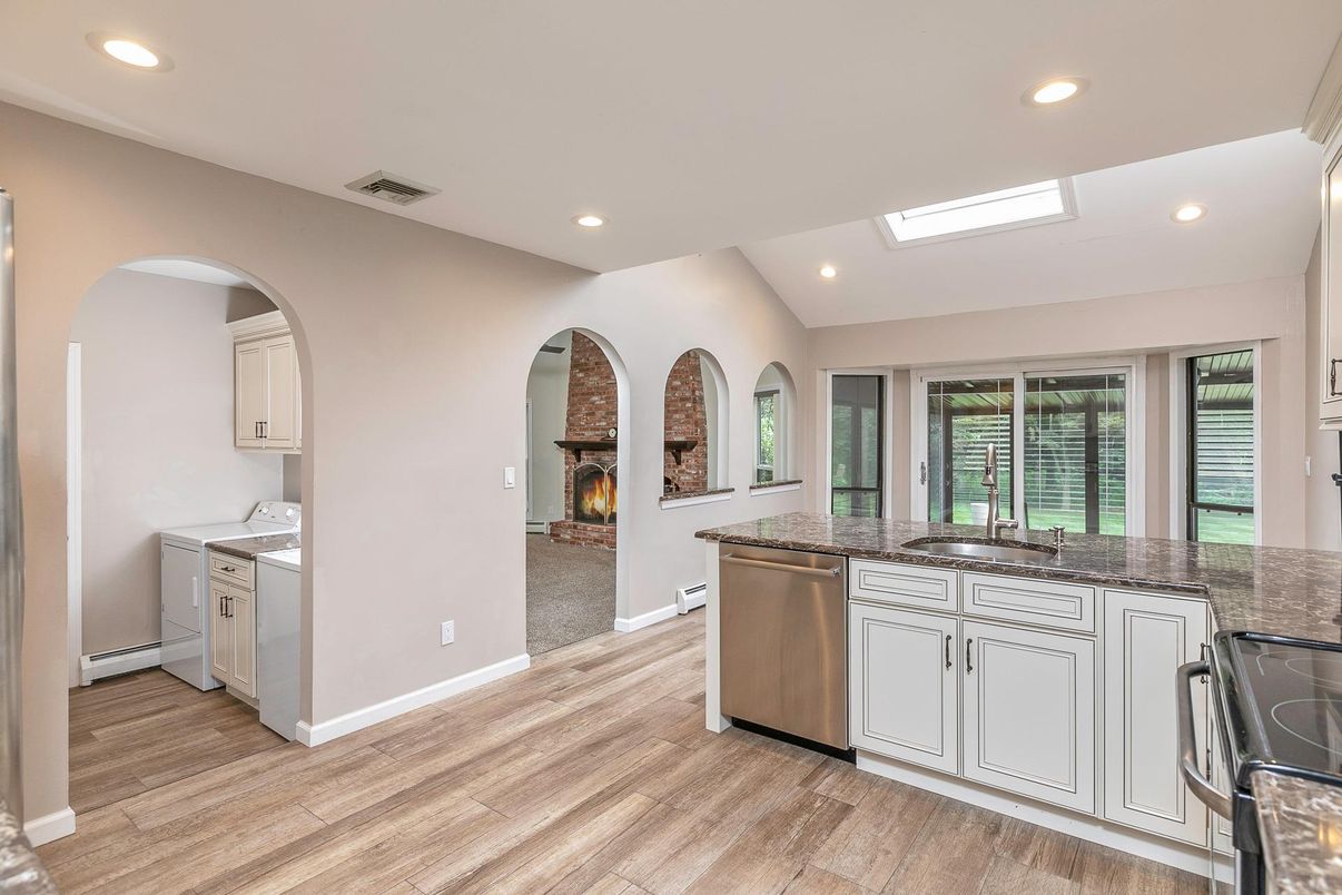 Fireplace, Interior, Kitchen, Recessed Lighting, Washer, Wood Texture Flooring
