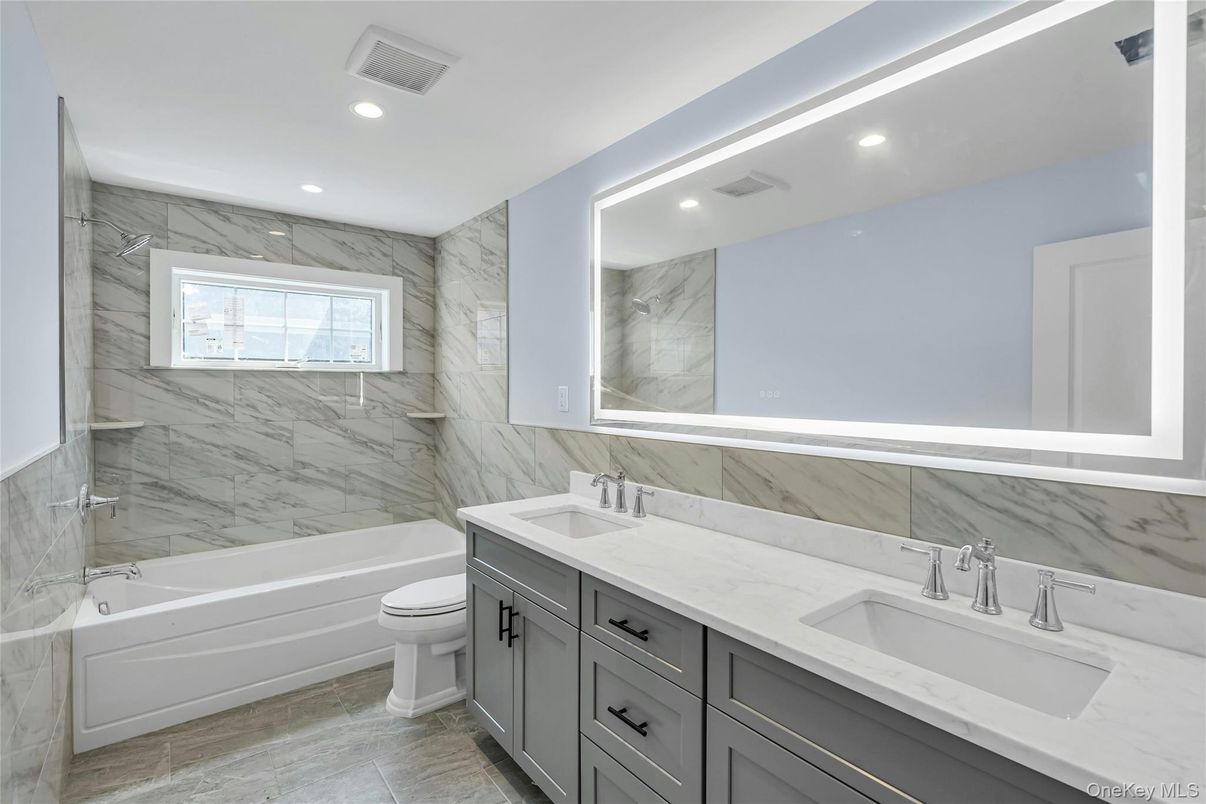 Bathroom, Dual Sink Vanities, Interior, Marble, Marble Walls, Recessed Lighting