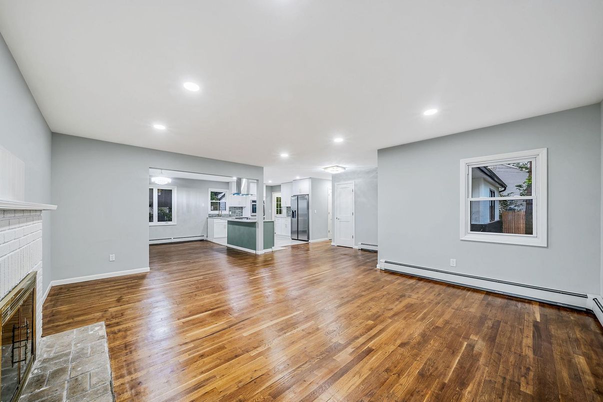 Empty room, Fireplace, Interior, Kitchen, Recessed Lighting, Wood Texture Flooring
