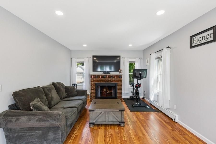 Fireplace, Fitness Equipment, Interior, Living room, Recessed Lighting, Wood Texture Flooring