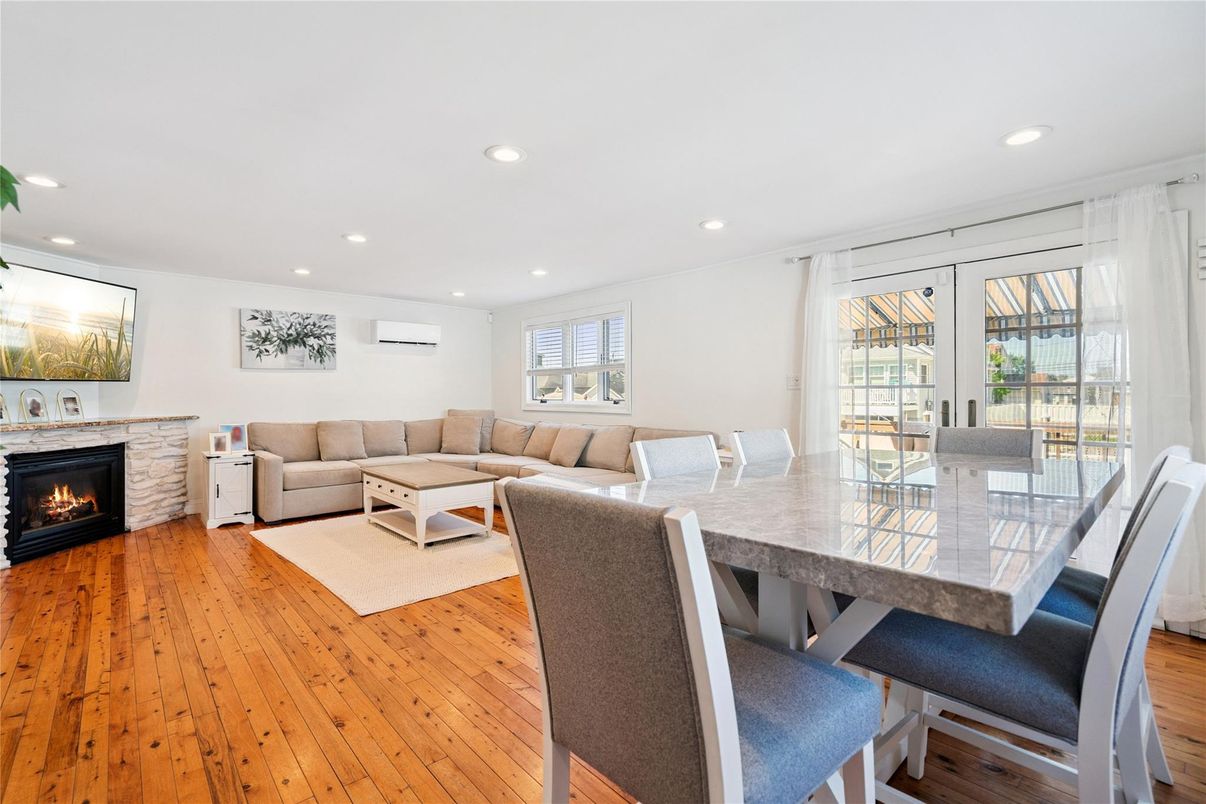 Dining room, Fireplace, Interior, Living room, Recessed Lighting, Wood Texture Flooring