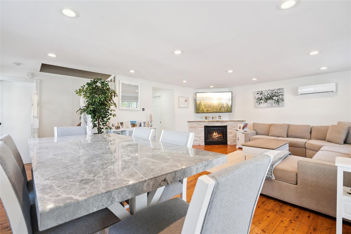 Dining room, Fireplace, Interior, Living room, Recessed Lighting, Wood Texture Flooring