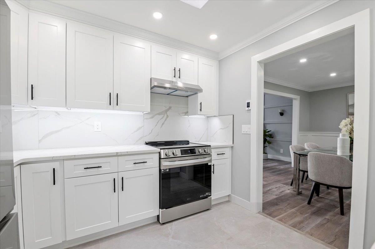 Interior, Kitchen, Marble Walls, Recessed Lighting, Stainless Steel Appliances, Wood Texture Flooring