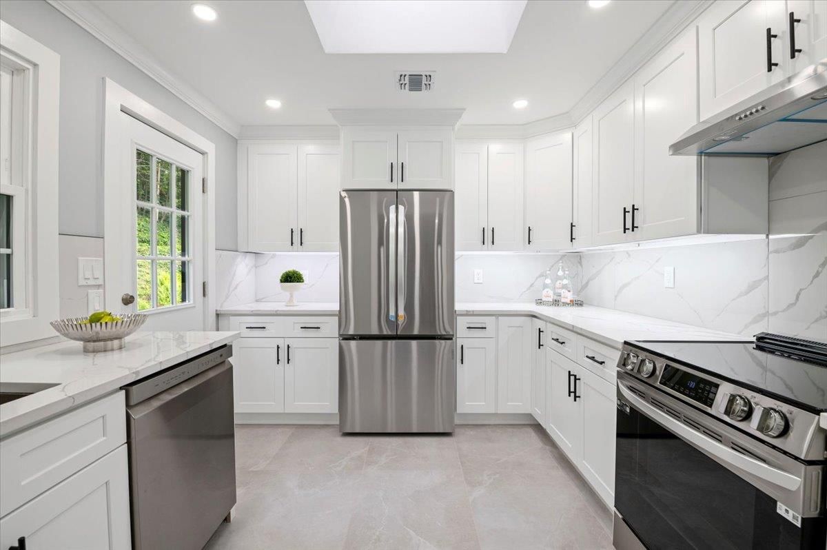Interior, Kitchen, Marble Walls, Recessed Lighting, Stainless Steel Appliances