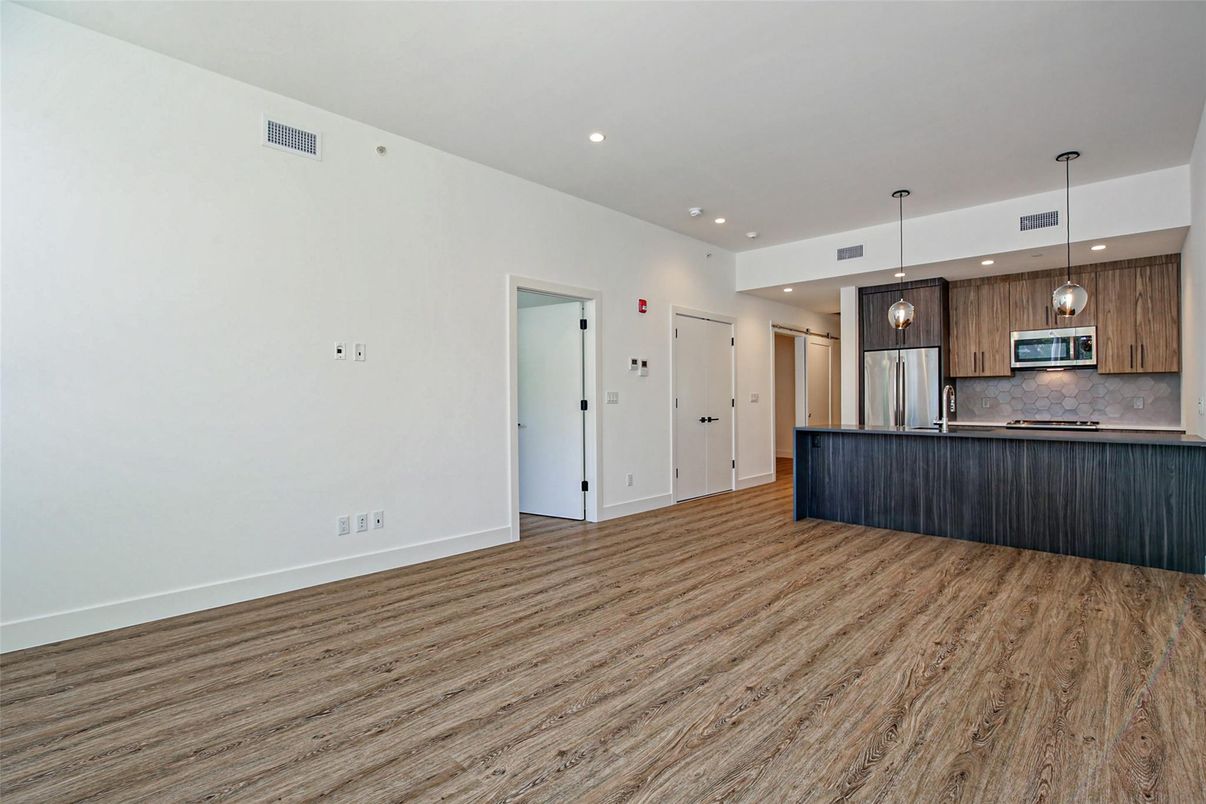Interior, Kitchen, Pendant Lights, Recessed Lighting, Stainless Steel Appliances, Wood Texture Flooring