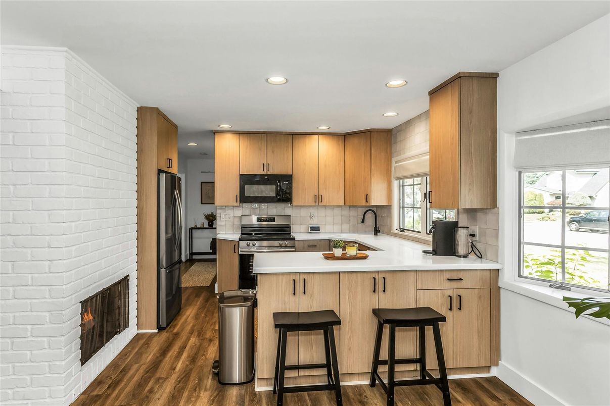 Fireplace, Interior, Kitchen, Recessed Lighting, Stainless Steel Appliances, Wood Texture Flooring