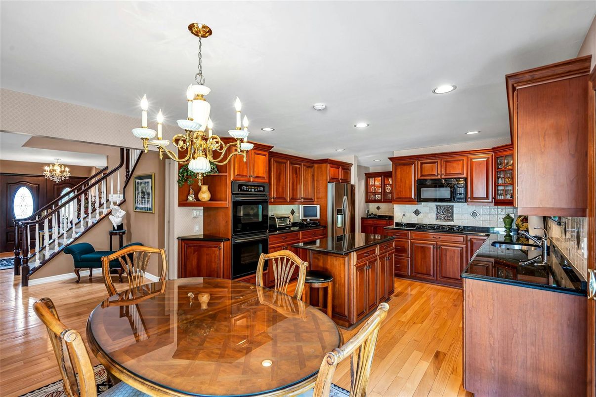 Chandelier, Dining room, Interior, Kitchen, Recessed Lighting, Stainless Steel Appliances, Wood Texture Flooring
