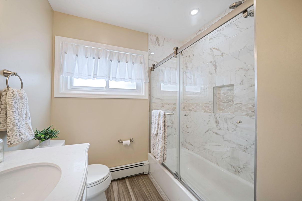 Bathroom, Glass Shower, Interior, Marble Walls, Recessed Lighting, Wood Texture Flooring