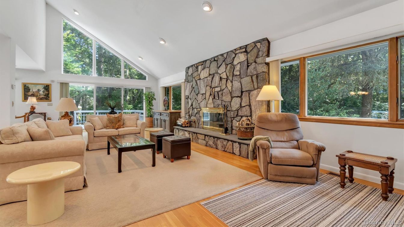 Fireplace, Interior, Living room, Recessed Lighting, Stone Walls, Wood Texture Flooring