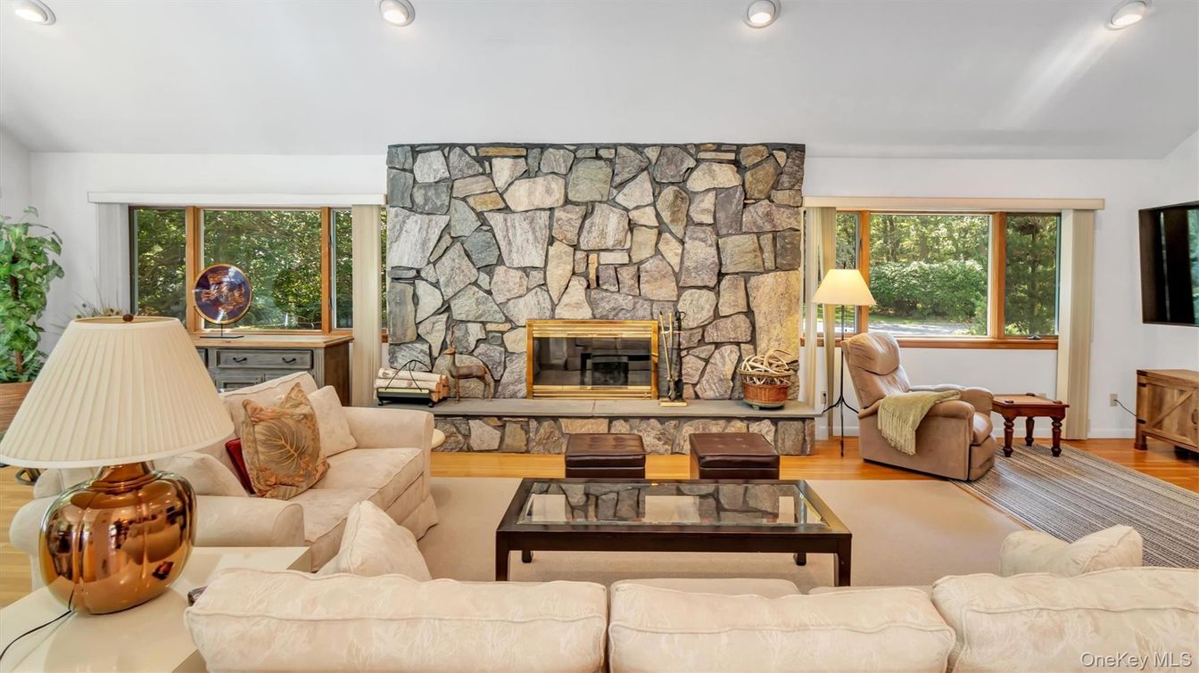 Fireplace, Interior, Living room, Recessed Lighting, Stone Walls, Wood Texture Flooring