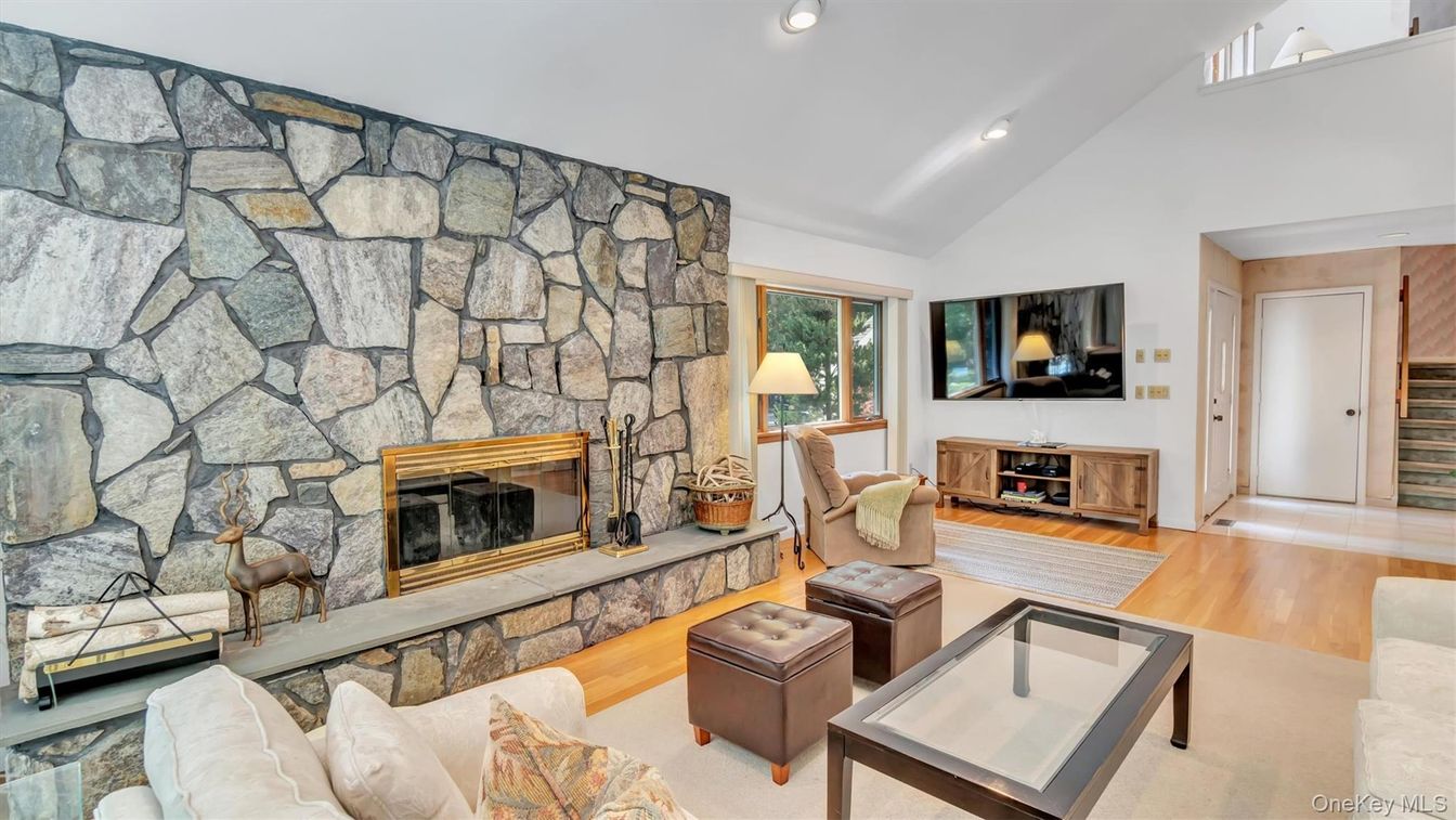 Fireplace, Interior, Living room, Recessed Lighting, Stone Walls, Wood Texture Flooring