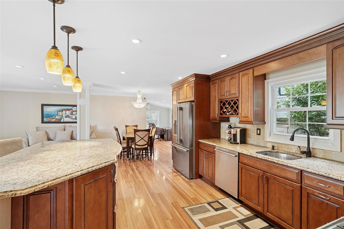 Dining room, Interior, Kitchen, Pendant Lights, Recessed Lighting, Stainless Steel Appliances, Wood Texture Flooring