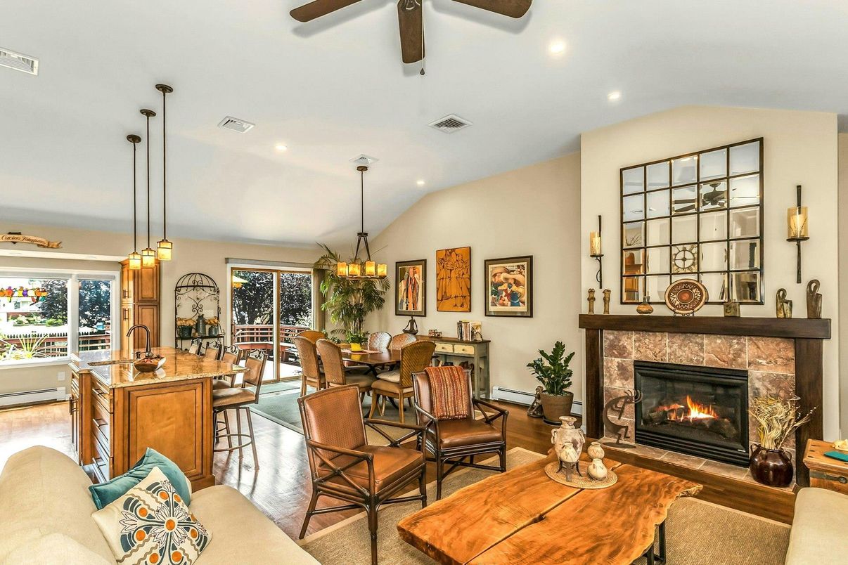 Chandelier, Dining room, Fireplace, Interior, Living room, Pendant Lights, Recessed Lighting, Wood Texture Flooring