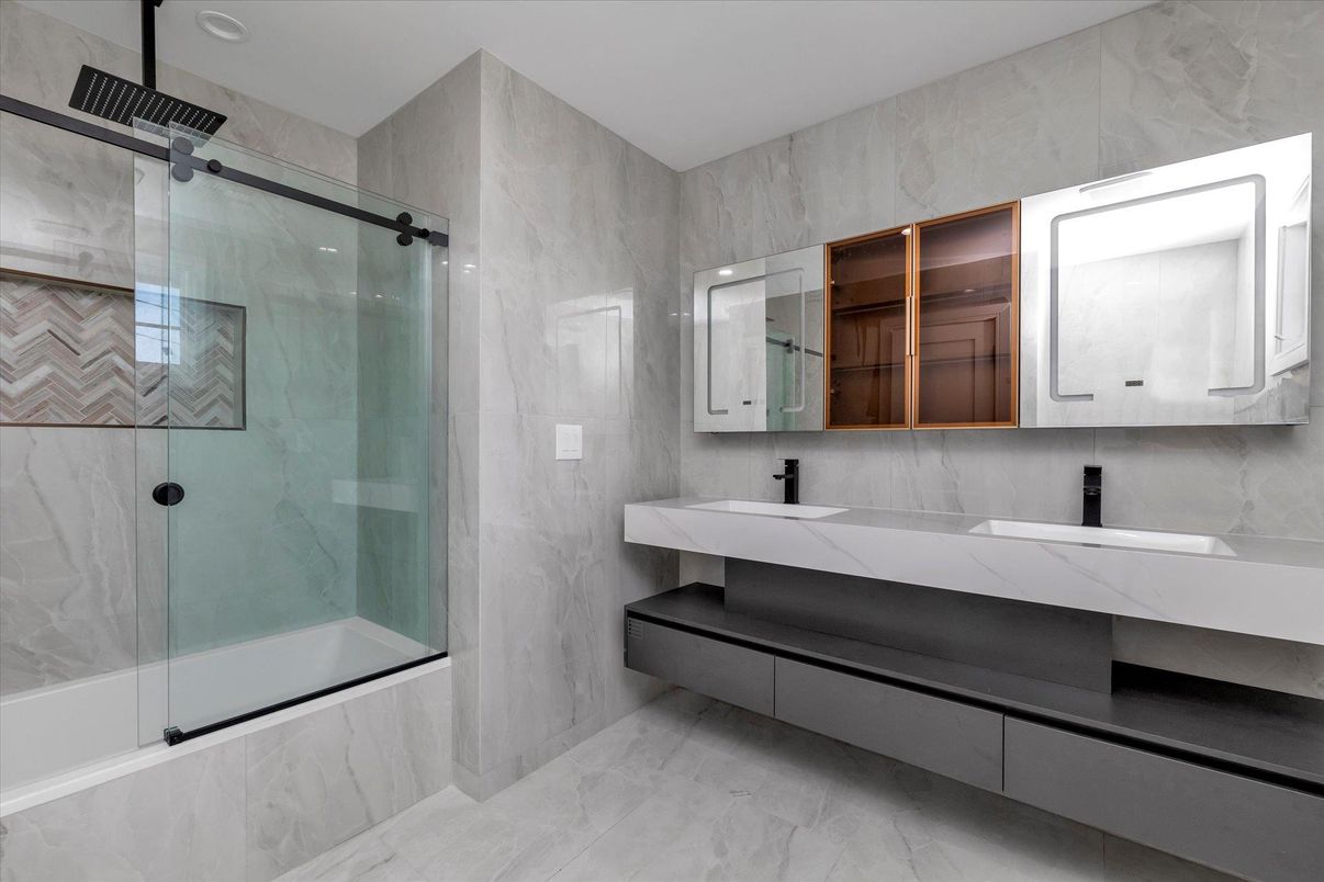 Bathroom, Dual Sink Vanities, Glass Shower, Interior, Marble, Marble Walls, Recessed Lighting