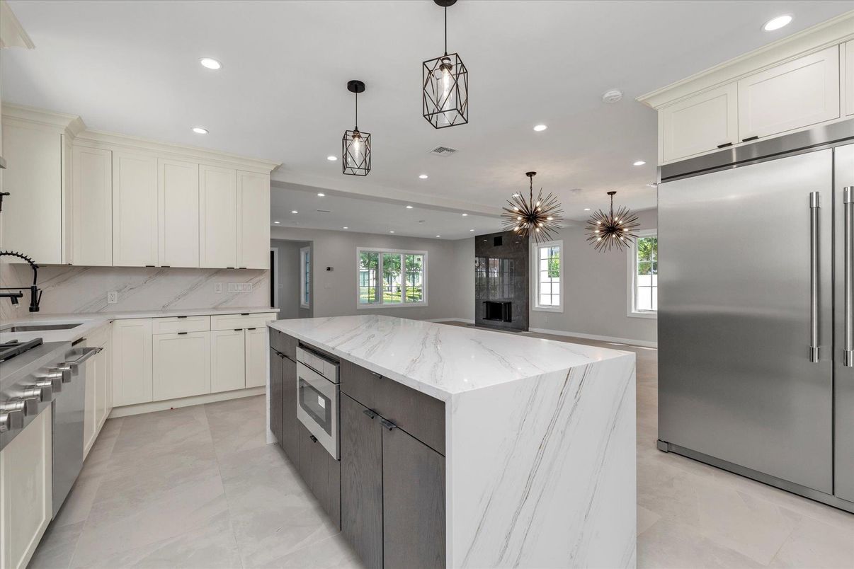 Interior, Kitchen, Marble Walls, Pendant Lights, Recessed Lighting, Stainless Steel Appliances