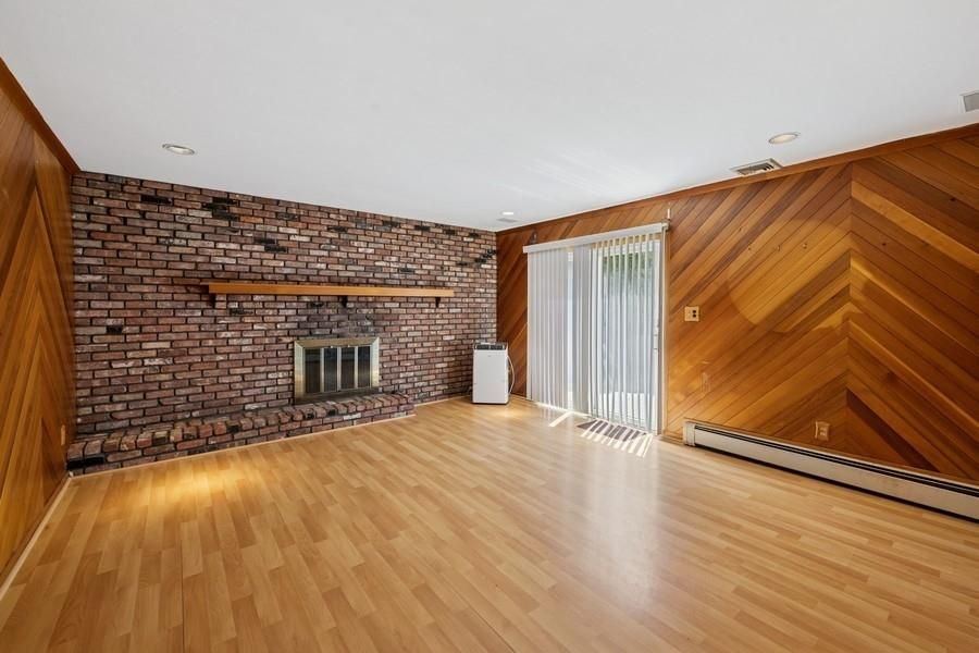 Empty room, Fireplace, Interior, Recessed Lighting, Stone Walls, Wood Texture Flooring, Wooden Walls