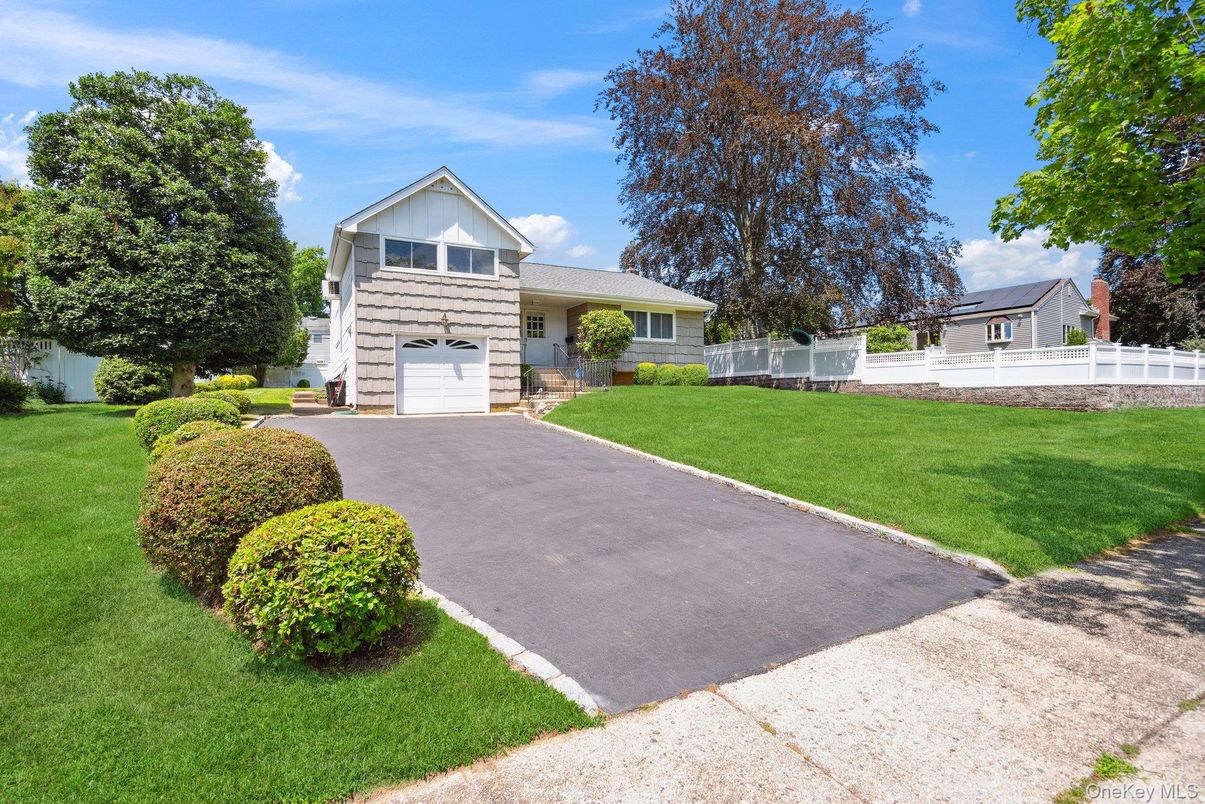 Attached, Backyard, Exterior, Facade, Solar Panels, Raised Ranch