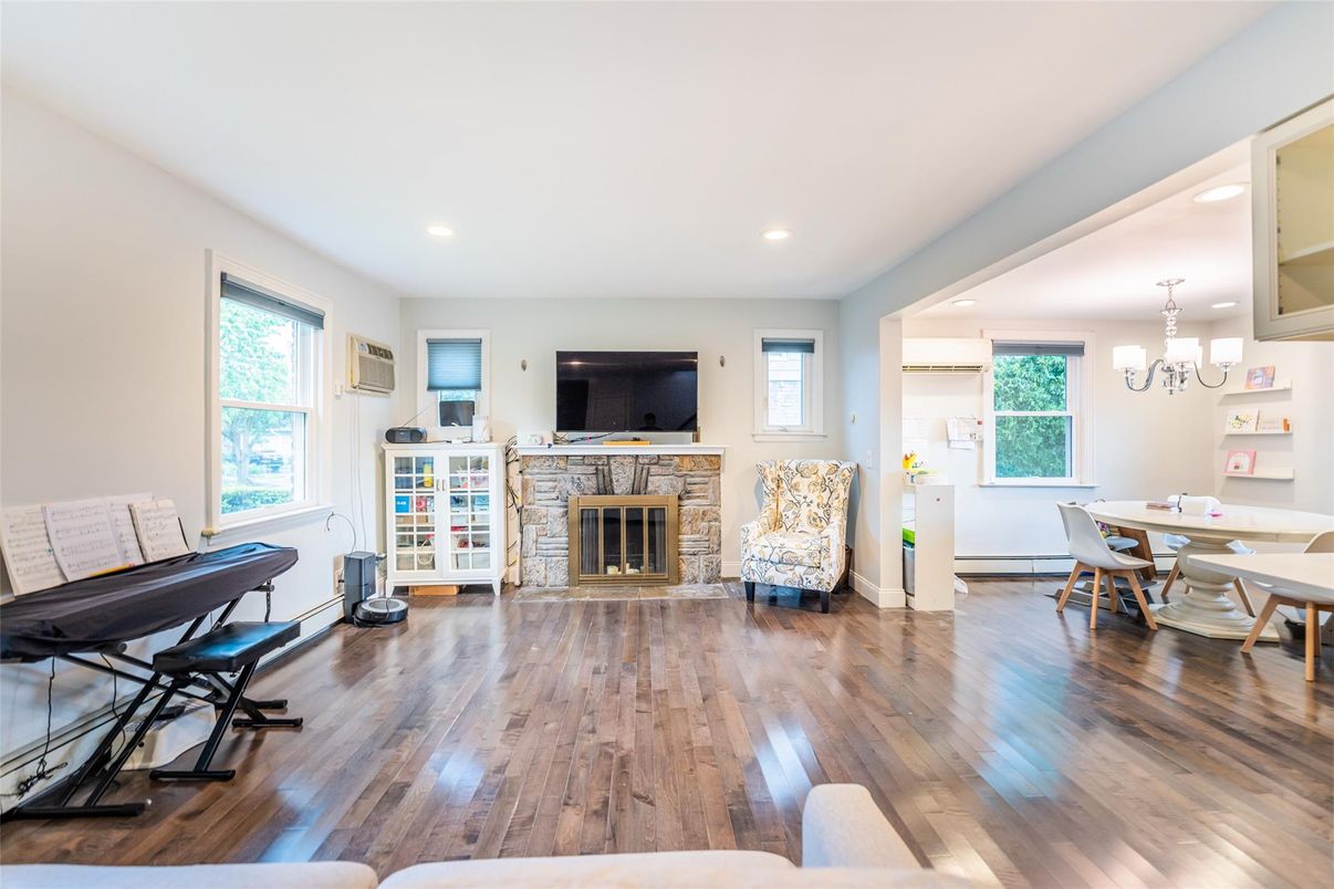 Chandelier, Dining room, Fireplace, Interior, Piano, Recessed Lighting, Wood Texture Flooring