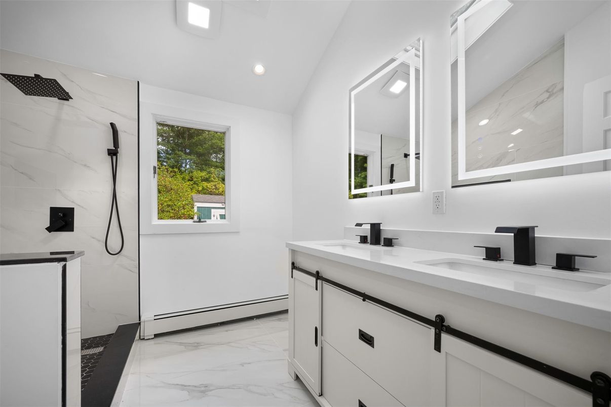 Bathroom, Dual Sink Vanities, Glass Shower, Interior, Marble, Marble Walls, Recessed Lighting
