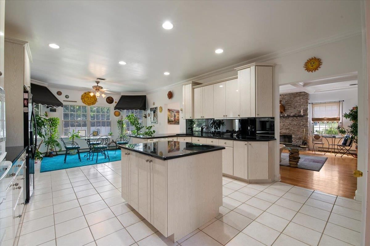 Dining room, Fireplace, Interior, Kitchen, Living room, Recessed Lighting, Wood Texture Flooring