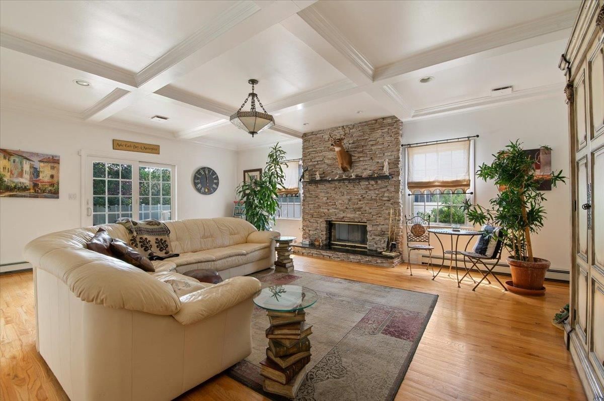 Fireplace, Interior, Living room, Recessed Lighting, Stone Walls, Wood Texture Flooring