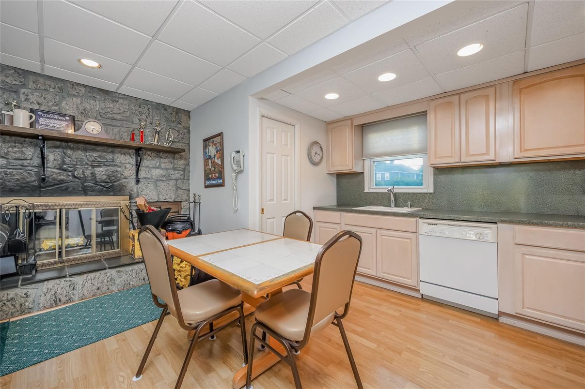 Dining room, Fireplace, Interior, Kitchen, Recessed Lighting, Stone Walls, Wood Texture Flooring