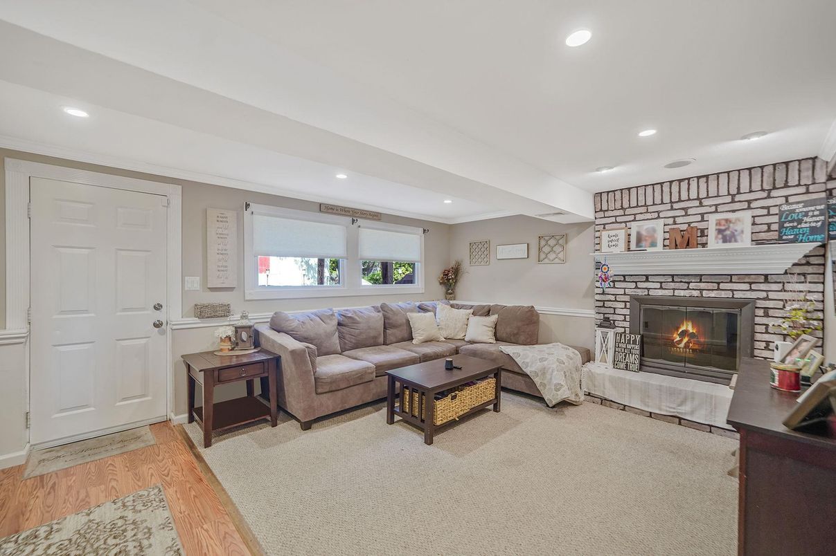 Fireplace, Interior, Living room, Recessed Lighting, Stone Walls, Wood Texture Flooring