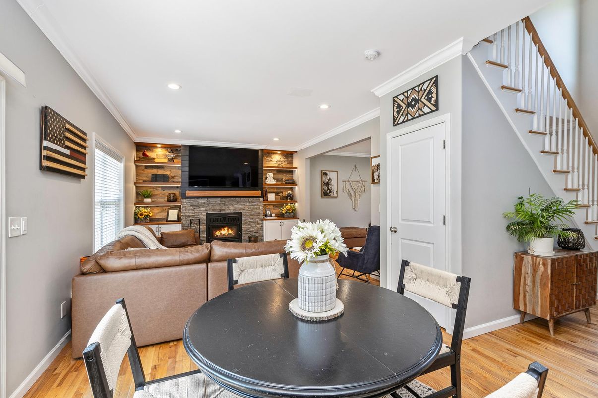 Dining room, Fireplace, Interior, Living room, Recessed Lighting, Wood Texture Flooring