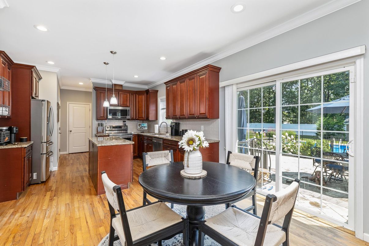 Dining room, Interior, Kitchen, Pendant Lights, Recessed Lighting, Stainless Steel Appliances, Wood Texture Flooring