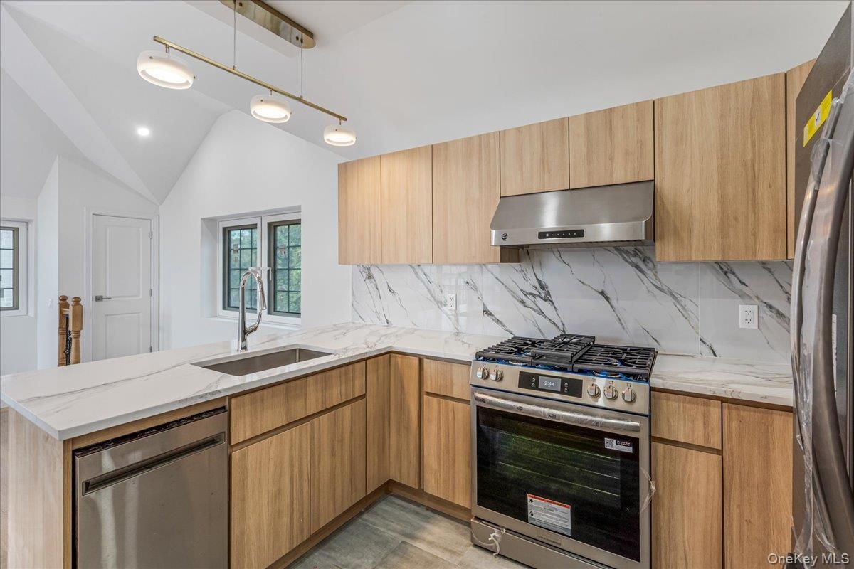 Interior, Kitchen, Marble Walls, Pendant Lights, Recessed Lighting, Stainless Steel Appliances, Wood Texture Flooring