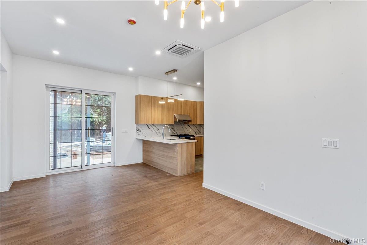 Interior, Kitchen, Marble Walls, Pendant Lights, Recessed Lighting, Wood Texture Flooring