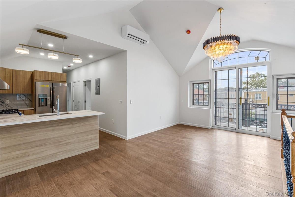 Chandelier, Interior, Kitchen, Pendant Lights, Recessed Lighting, Stainless Steel Appliances, Wood Texture Flooring