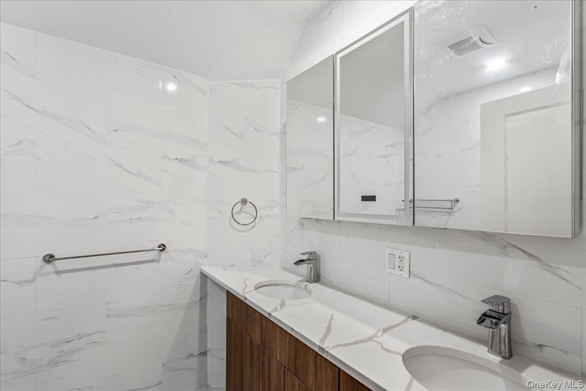 Bathroom, Dual Sink Vanities, Interior, Marble Walls, Recessed Lighting