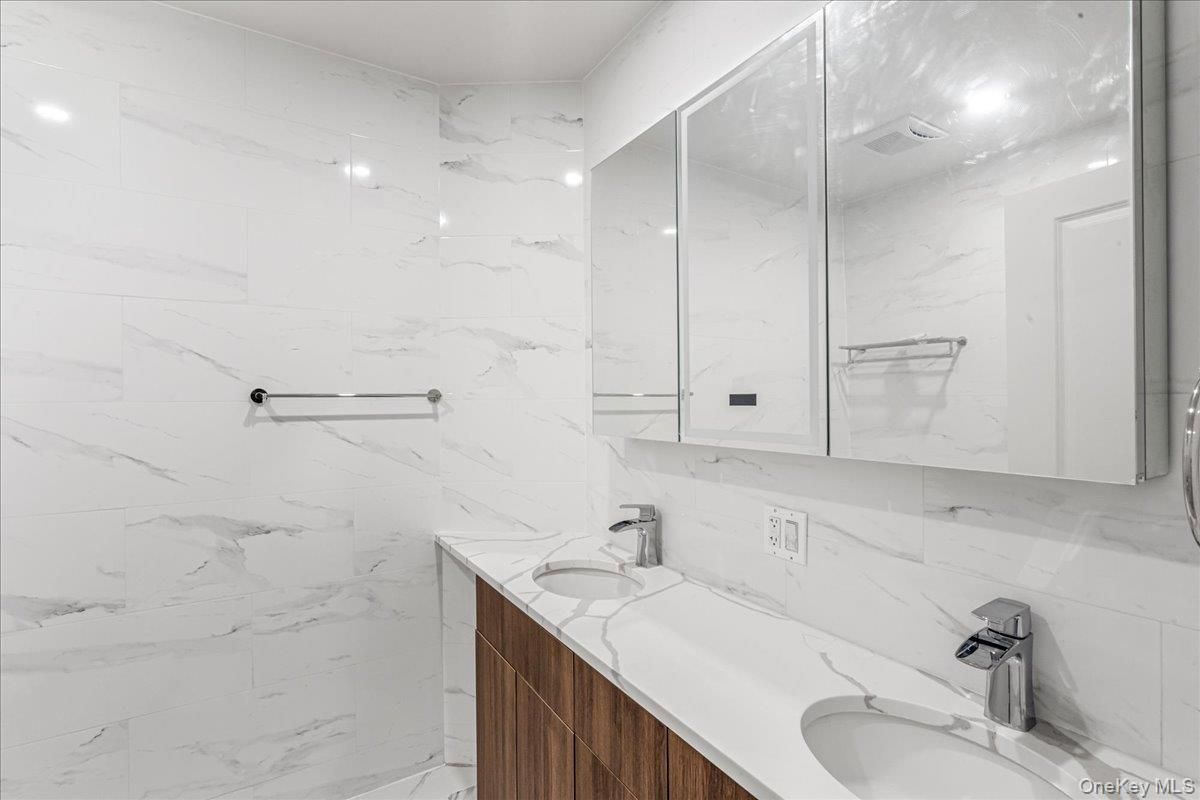 Bathroom, Dual Sink Vanities, Interior, Marble Walls, Recessed Lighting