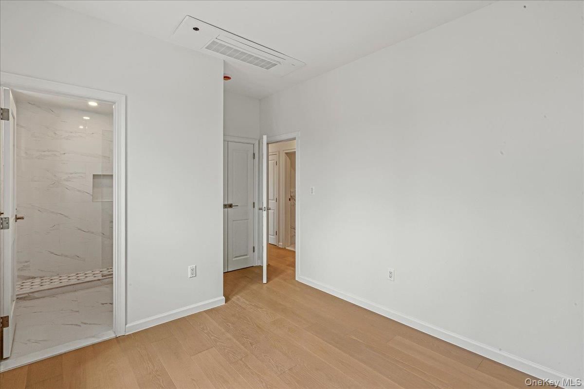 Bathroom, Empty room, Interior, Marble Walls, Recessed Lighting, Wood Texture Flooring