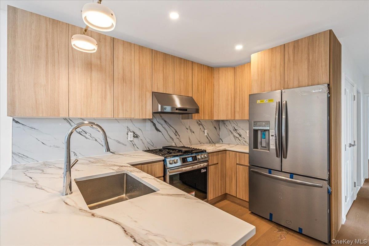Interior, Kitchen, Marble Walls, Pendant Lights, Recessed Lighting, Stainless Steel Appliances, Wood Texture Flooring