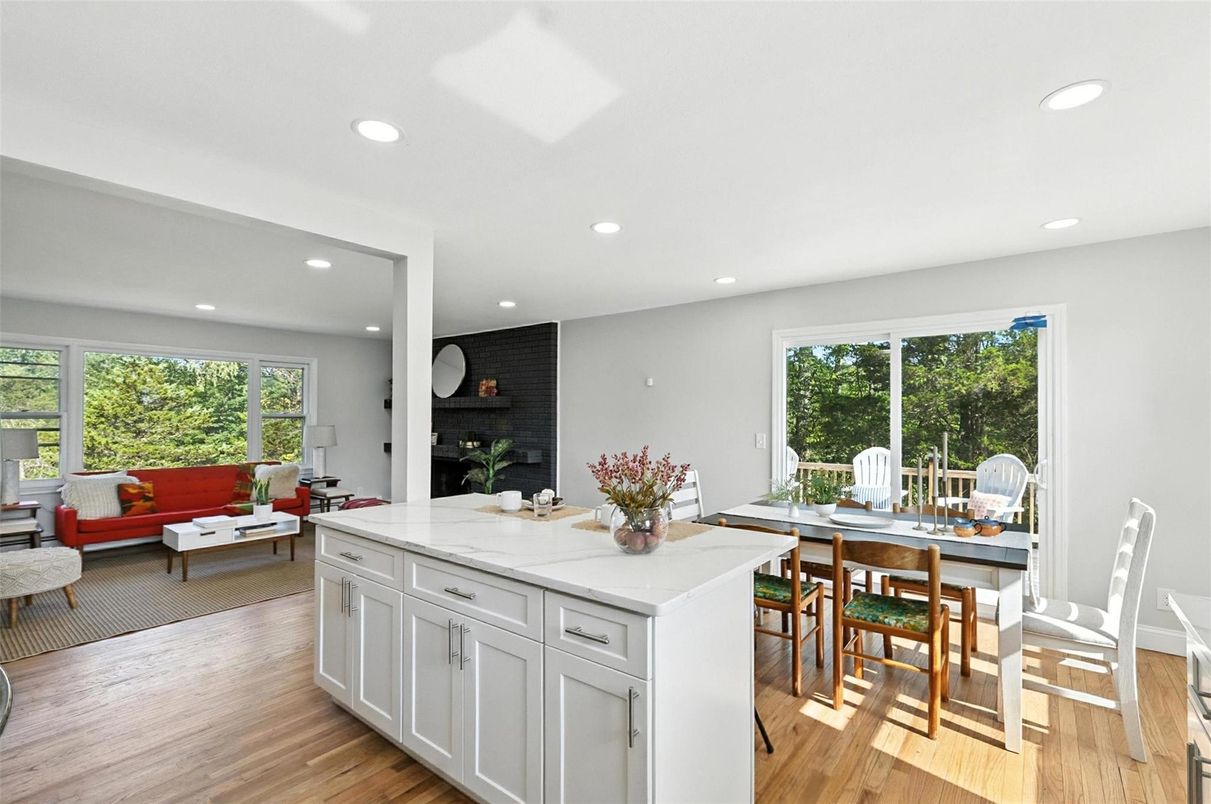 Dining room, Fireplace, Interior, Living room, Recessed Lighting, Stone Walls, Wood Texture Flooring
