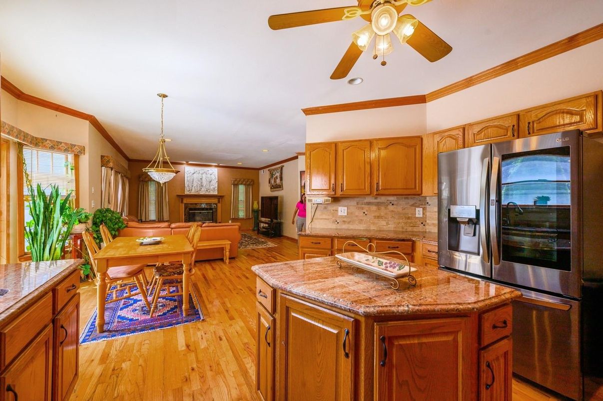 Dining room, Fireplace, Interior, Kitchen, Living room, Pendant Lights, Recessed Lighting, Stainless Steel Appliances, Wood Texture Flooring
