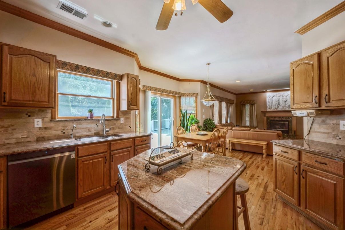 Dining room, Fireplace, Interior, Kitchen, Living room, Pendant Lights, Recessed Lighting, Stainless Steel Appliances, Wood Texture Flooring