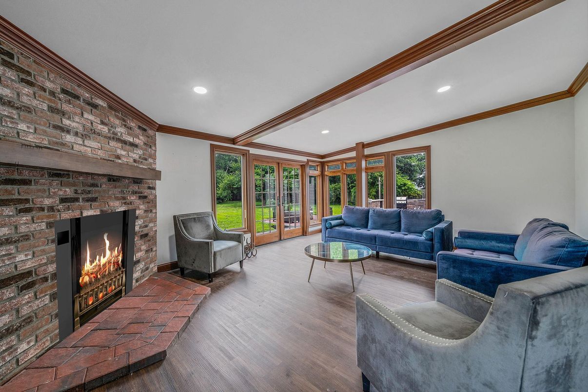 Fireplace, Interior, Living room, Recessed Lighting, Stone Walls, Wood Texture Flooring
