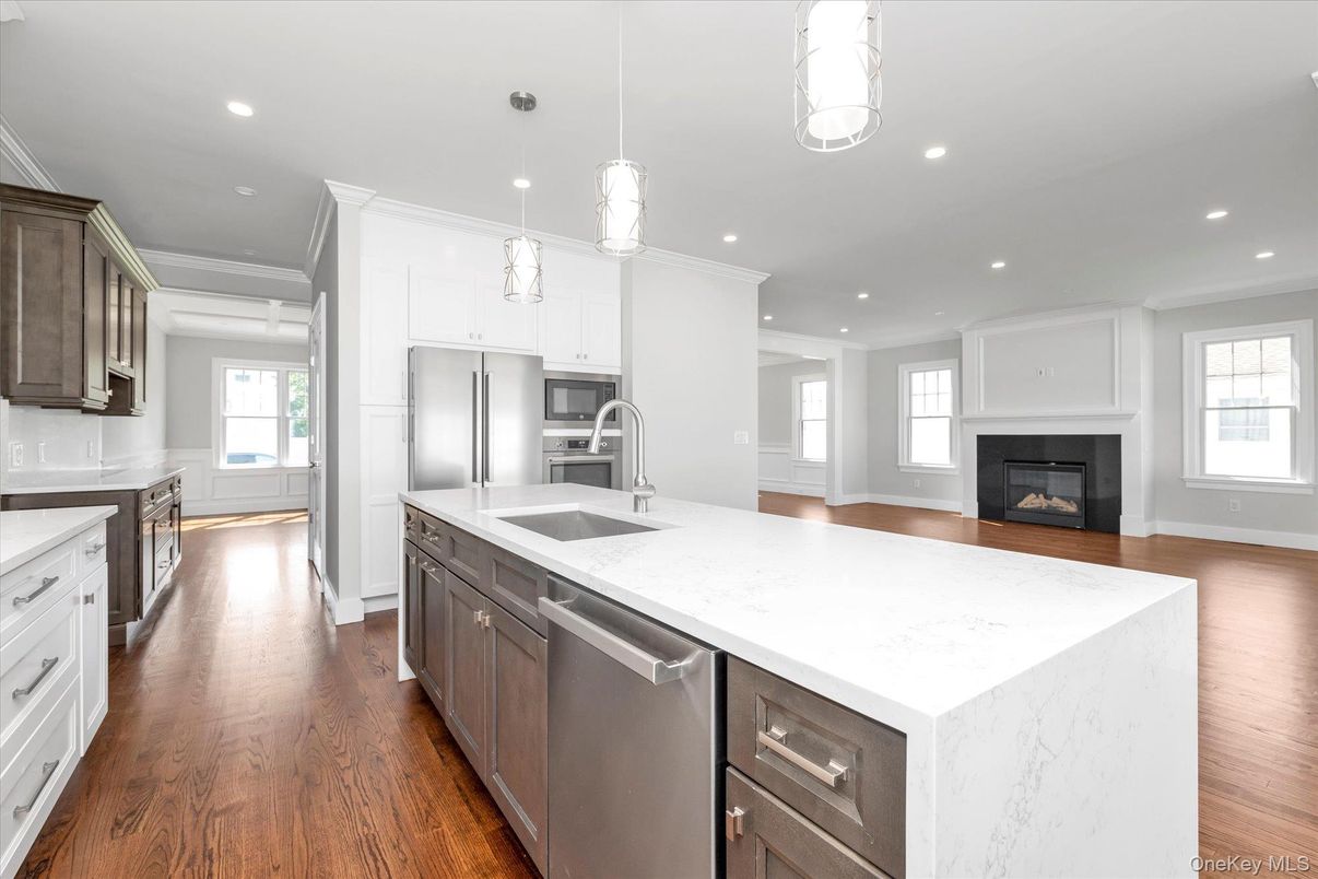 Fireplace, Interior, Kitchen, Pendant Lights, Recessed Lighting, Stainless Steel Appliances, Wood Texture Flooring