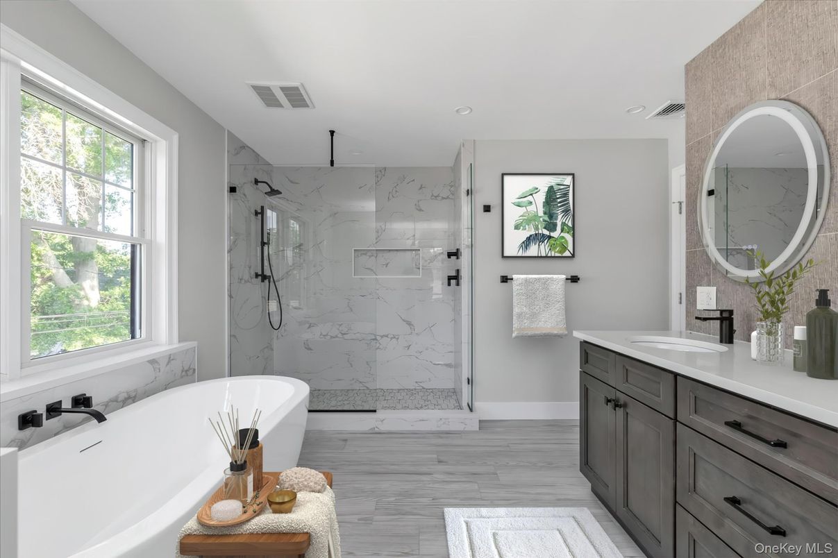 Bathroom, Dual Sink Vanities, Free Standing Baths, Glass Shower, Interior, Marble Walls, Recessed Lighting, Wood Texture Flooring