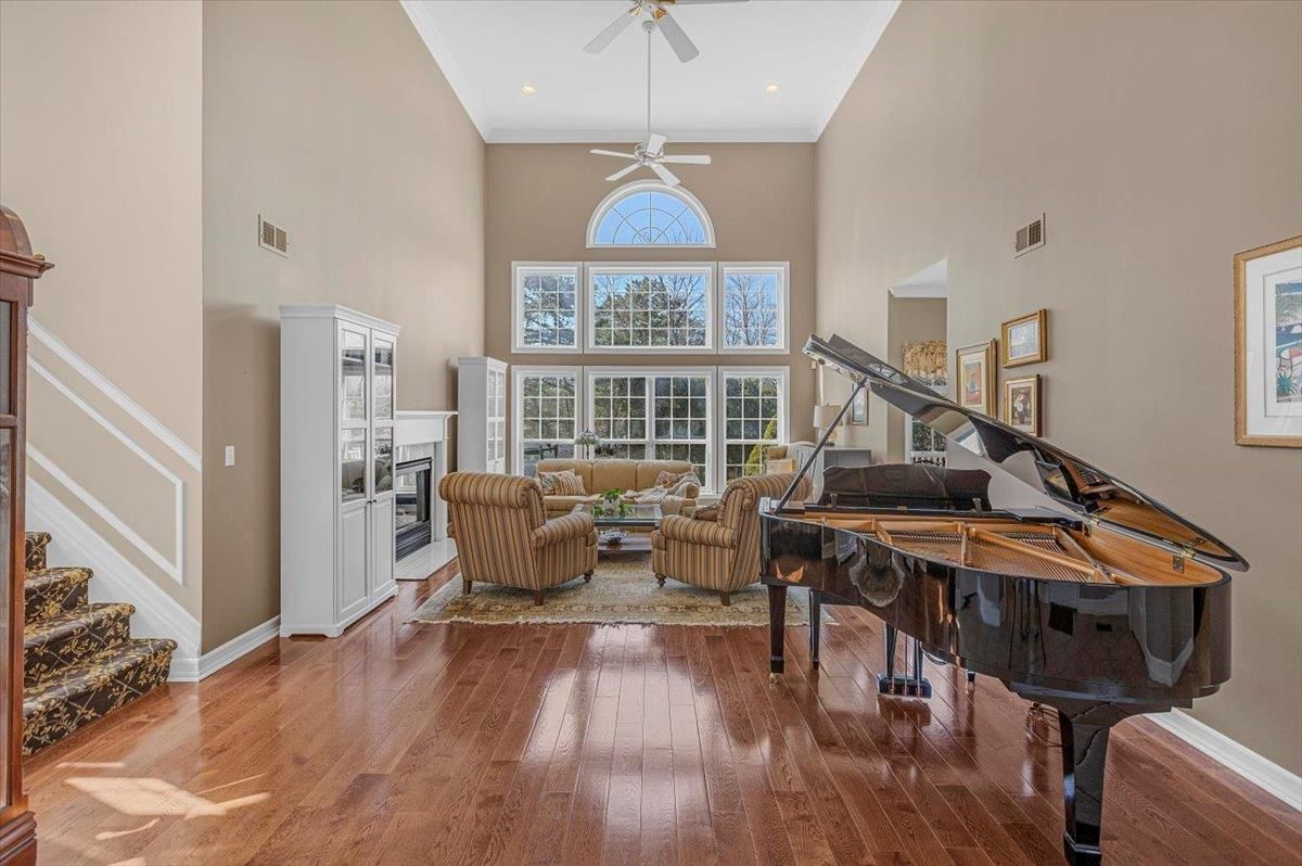 Fireplace, Interior, Living room, Piano, Recessed Lighting, Wood Texture Flooring