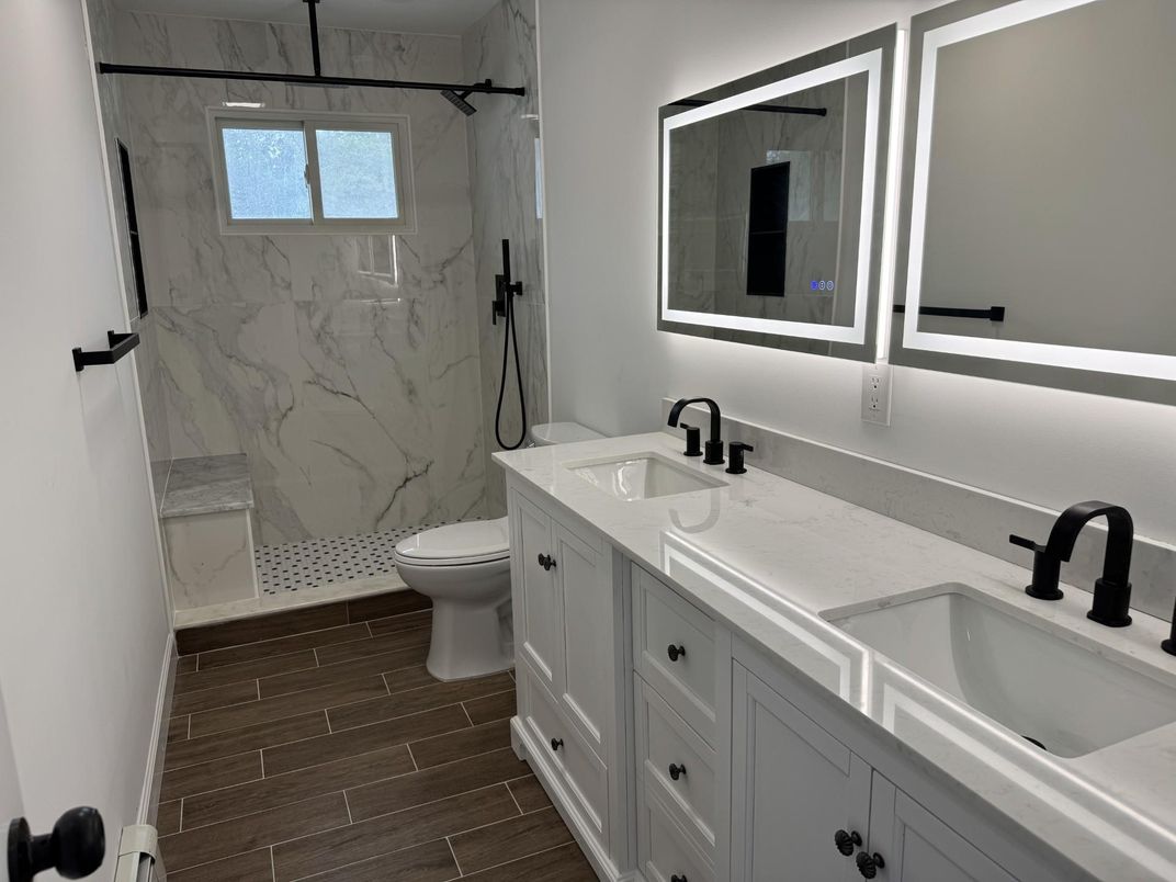 Bathroom, Dual Sink Vanities, Glass Shower, Interior, Marble Walls, Wood Texture Flooring