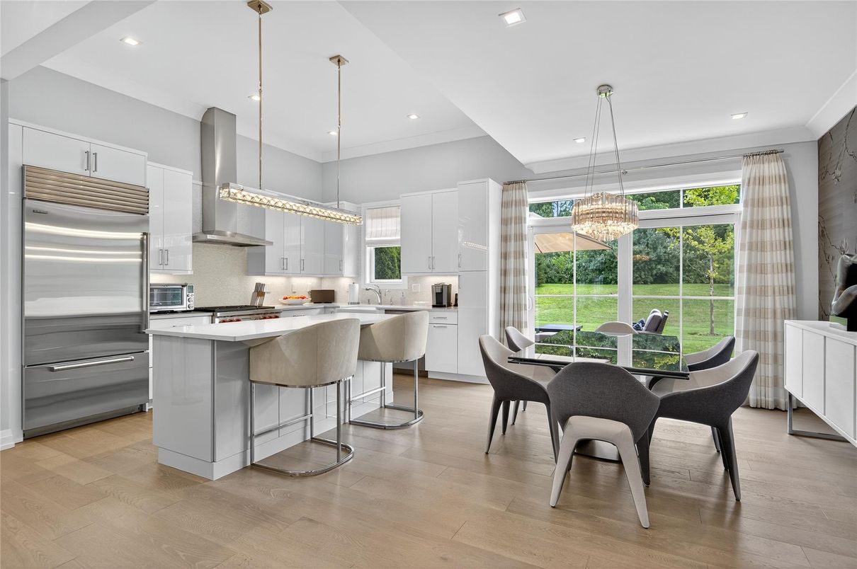 Chandelier, Dining room, Interior, Kitchen, Pendant Lights, Recessed Lighting, Stainless Steel Appliances, Wood Texture Flooring