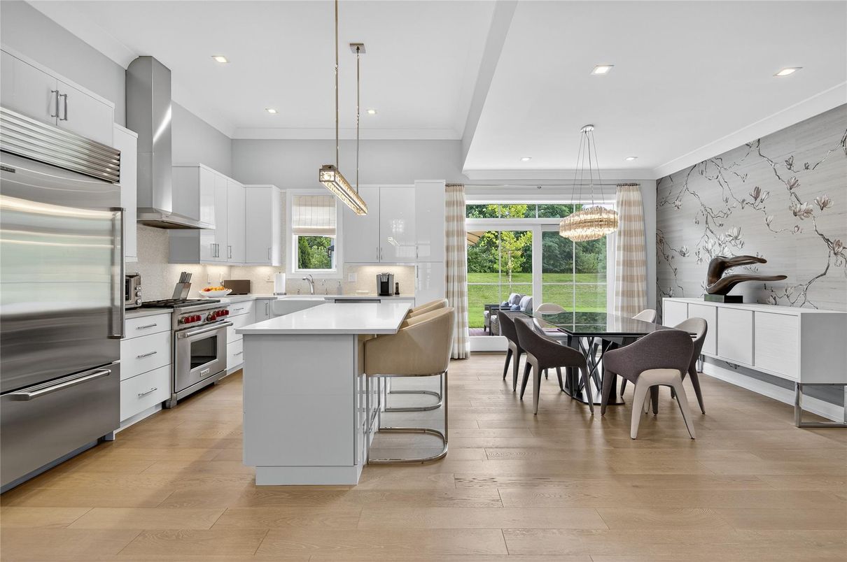 Chandelier, Dining room, Interior, Kitchen, Pendant Lights, Recessed Lighting, Stainless Steel Appliances, Wood Texture Flooring