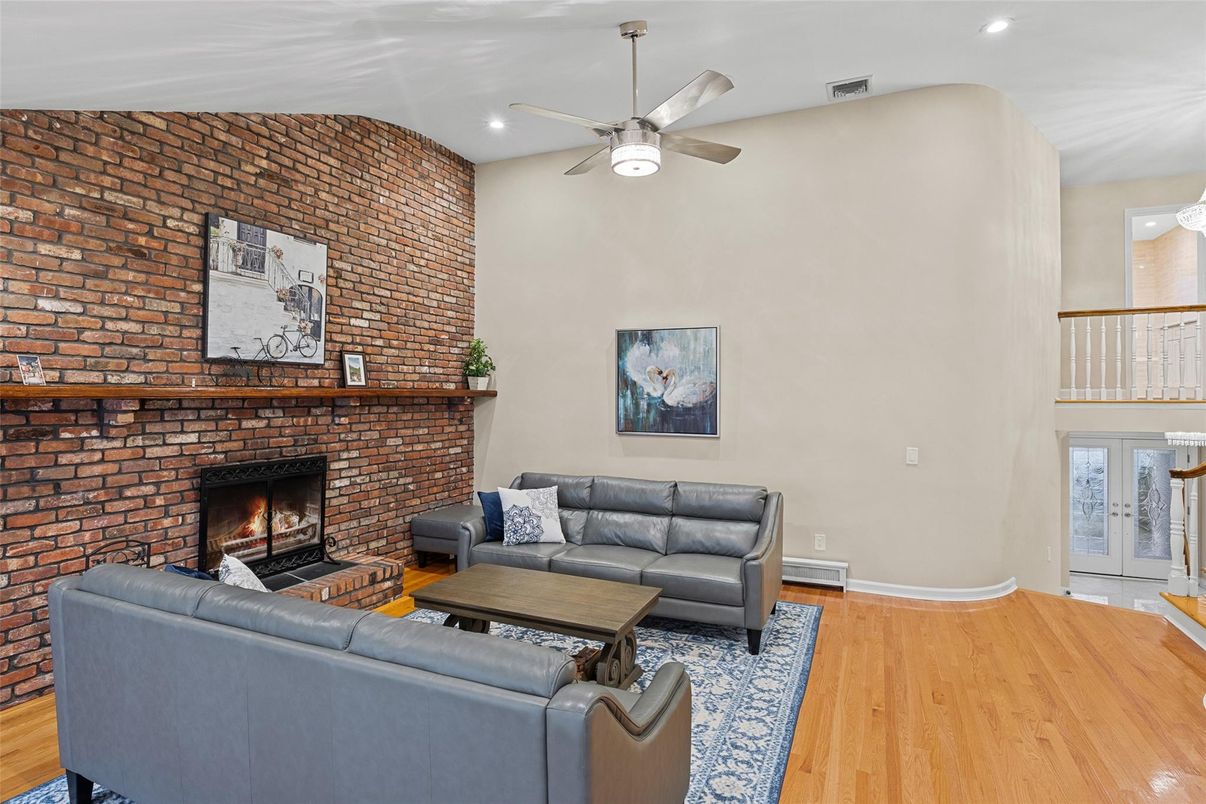 Fireplace, Interior, Living room, Recessed Lighting, Stone Walls, Wood Texture Flooring