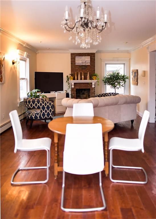 Chandelier, Dining room, Fireplace, Interior, Living room, Wood Texture Flooring