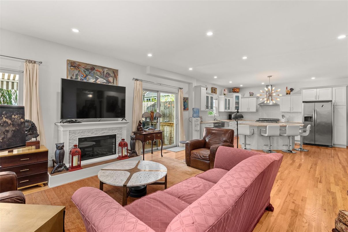Fireplace, Interior, Kitchen, Living room, Pendant Lights, Recessed Lighting, Stainless Steel Appliances, Wood Texture Flooring